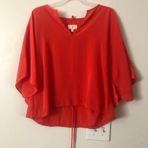 Lou and Grey-orange bell sleeve shirt with bottom tie.